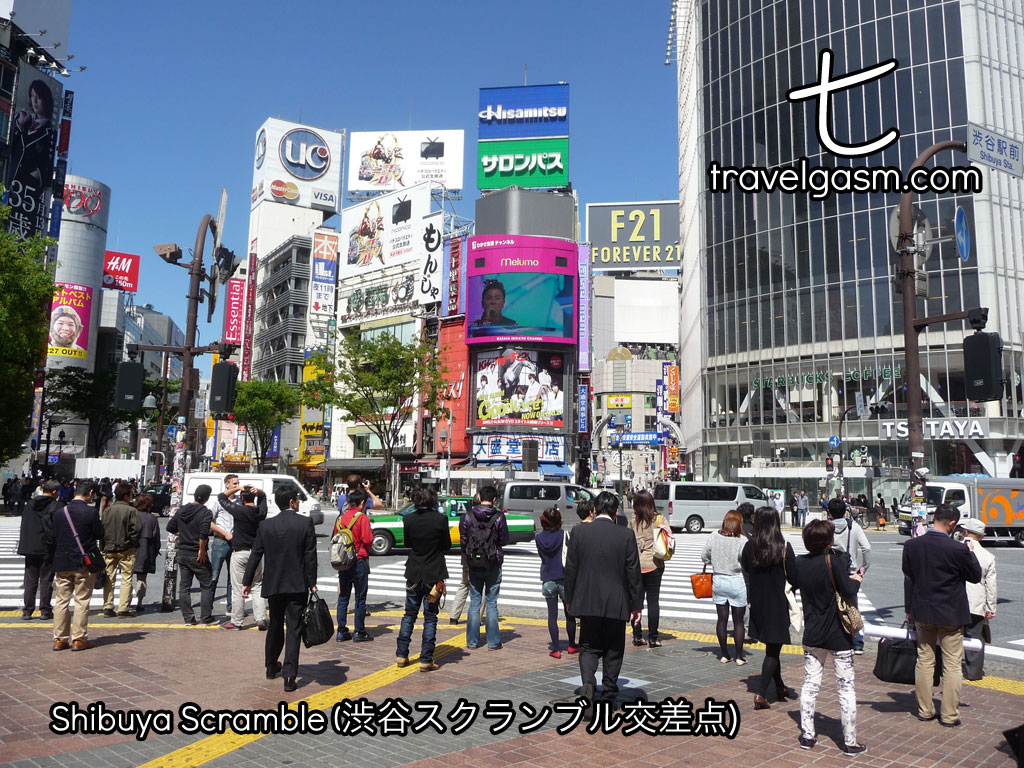 People line up during the day to head across the Shibuya Scramble Crossing.